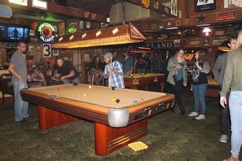 Folks come for the live music, performed on a small corner stage, a round of darts or pool, and a bottle of cold beer. . Dive bars with pool tables near me